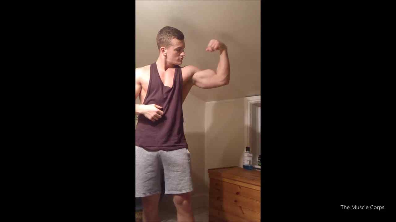 Young muscular guy flexing and showing off his body